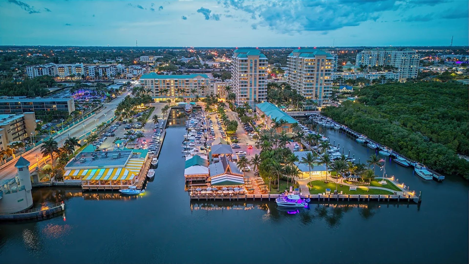 Boynton Harbor Marina and the downtown Boynton Beach waterfront at dusk, seen from above the Intracoastal Waterway
